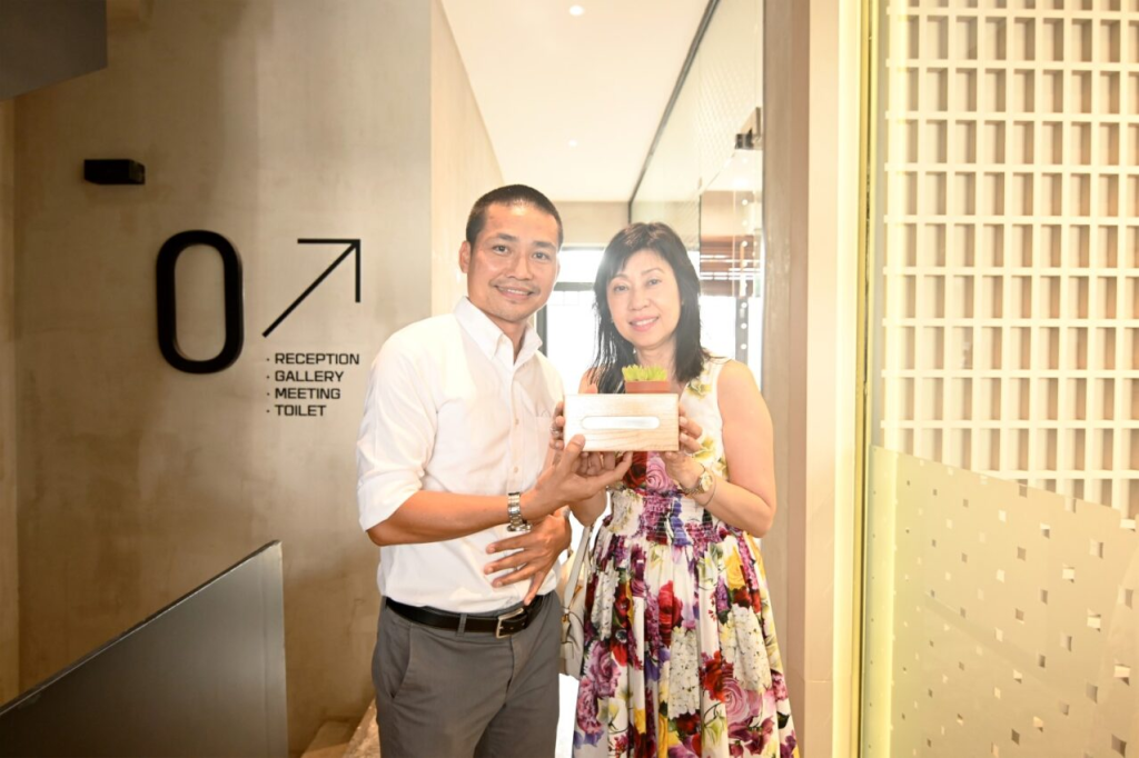 Mr. Nghia presents gift to KinderWorld team