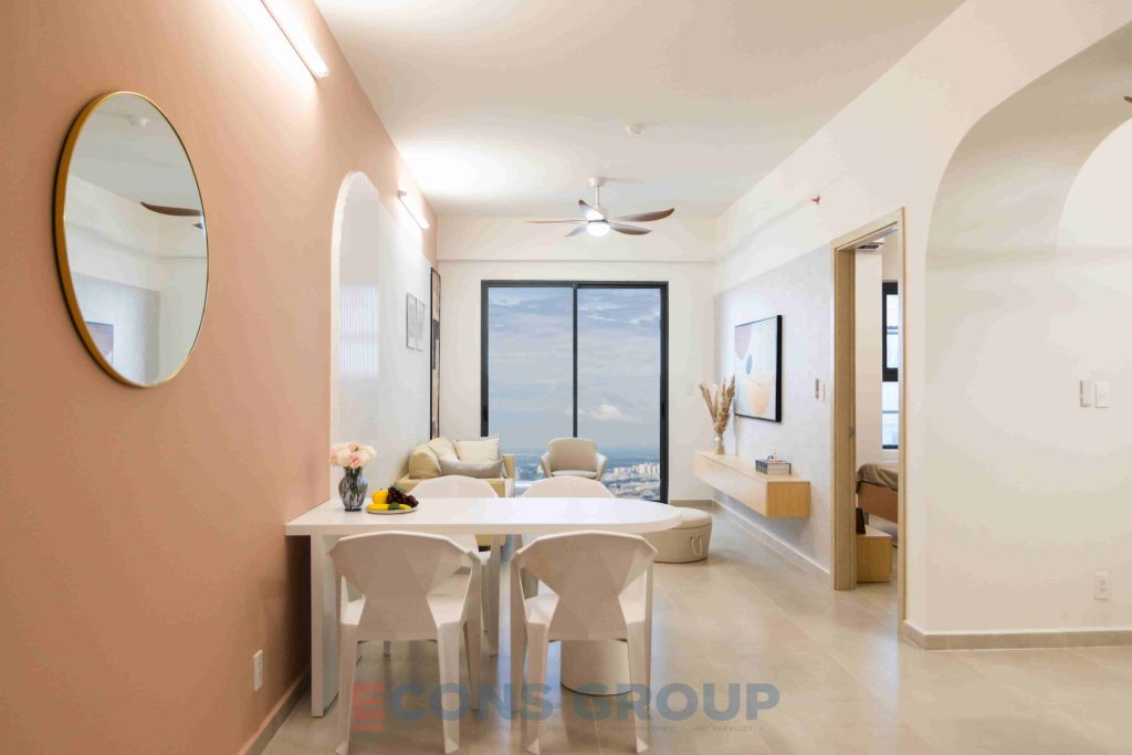 Modern and compact social housing apartment with white and orange color scheme.